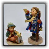 C10. Two Hummel figurines.  One with small chip to cap and the other with a crack in base. - $12 for the pair