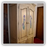 F17. Painted media armoire with irises on the doors. - $150