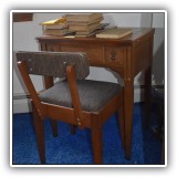 F29. Sewing table with Singer sewing machine and chair - $80.