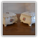 E53. Two porcelain boxes. Dimensions: 5"W - $20 for the pair
