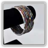 J14. Set of 7 cloisonne bangle bracelets - $38