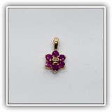 J15. 14K Ruby and diamond flower pendant - $85