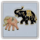J20. Pair of enamel elephant pins.  Black elephant is missing one crystal - $14	