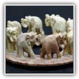 C30. Carved stone ring of elephants. $10