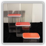K37. 5-Piece plastic storage set with red lids - $8
