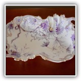 E16. Purple and gold porcelain bowl. Measures: 14" x 8.5" - $24