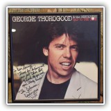 B29. Autographed George Thorogood and the Destroyers album cover. - $100