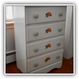 F55. White four-drawer dresser with flower designs. 34"h x 24"w x 13"d - $48