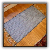 D62. Blue throw rug