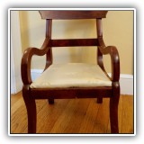 F40. Wooden child's chair with cream-colored dragonfly upholstery.  Some discoloration to upholstery. 20"h x 14"w x 13"d - $48
