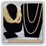 J28. Three faux pearl necklaces