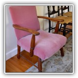 F63. Chair with pink upholstery