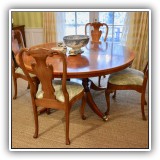 F17. Round Pedestal dining table and 10 chairs purchased from Mill House Antiques in CT.  Set includes 2 leaves. Table dimensions: 29.5"h x 60"w. Chairs: 40"h - $4,200 for the set