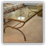 F9. Glass top coffee table. 17"h x 52"w x 24"d - $295