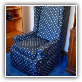 F47. Slipcovered wing chair with paisley fabric. 45"w x 27"w x 33"d - $85