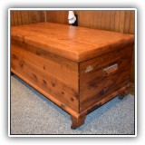 F66. Cedar chest on casters.  Water marks to top. - $40