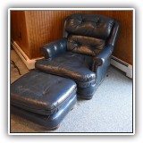F70. Lone Star Leather navy blue leather chair and ottoman with nailhead trim.  Wear to leather. Chair: 34"h x 34"w x 44"d Ottoman: 13"h x 24"w x 22"d - $375 for set