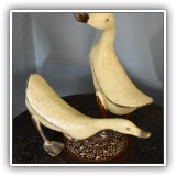 D63. Pair of wooden geese. 13.5"h and 7"h - $48 for the pair