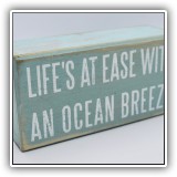 D67. Small "Life's at easeeith an ocean breeze" sign - $4