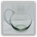G21. Green glass pitcher. 7"h - $12