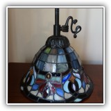 D25. Quoizel Tiffany style pendant light. Shade measures approx. 6"h x 9". Total height: 27" - $65