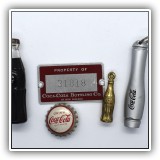 C15. Collection of small Coca-Cola items. - $10