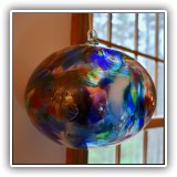 D77. Hand blown hanging glass ball. 7.5"h x 8.5"w - $85