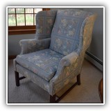 F22. Wing back chair with blue floral upholstery. 41"h x 34"w x 32"d - $95