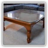 F24. Nichols and Stone coffee table with glass top. 17"h x 36"w x 36"d - $225