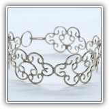 J29. Silver scrollwork bracelet. - $14