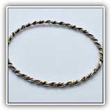 J30. Silver and goldtone twist bracelet. - $32