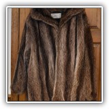 H42. Raccoon fur coat. - $150