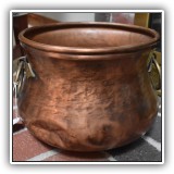 D99. Copper pot with brass handles. 8.5"h x 11.5"w - $64