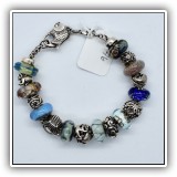 J46. Sterling Trollbeads bracelet. 7.5" with 17 beads. - $325