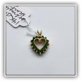 J48. 14K Gold heart pendant with emeralds and a diamond. - $110