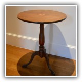 F02. Mahogany tilt-top tea table with inlaid medalion. 27"h x 22"w - $275