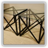 F67. Pair of metal and glass top side tables. 22"h x 20"w x 20"d - $150 each