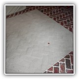 D38. Diamond pattern woven rug. May need cleaning. 8' x 6' - $36