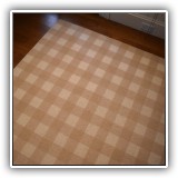 D31. Custom wool checked rug. 16' x 9'3" - $175