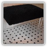 F88. Black shag fabric bench with lucite legs. 17.5"h x 24"w x 17"d - $60