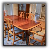 F14. William Tillman mahogany top dining table with triple banded edge and two 18" leaves. 29"h x 62"w x 42"d - $1800