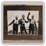 C01. Framed photo of three skiers aurographed by Jean Claude Killy. 11.5"x14.5" - $24