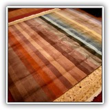 D33. Striped rainbow rug. 8' x 10' - $175