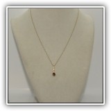 J06. 14K gold chain with diamond and stone pendant. 16" - $195