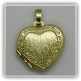 J07. 14K Gold heart locket. - $120