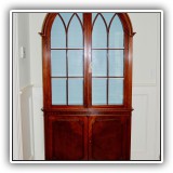 F16. Flame mahogany china cabinet with arched top. 82.5" x 40"w x 14"d - $1,800
