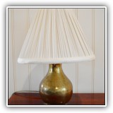 D10. Small hammered brass table lamp with ivory shade. 16"h - $48